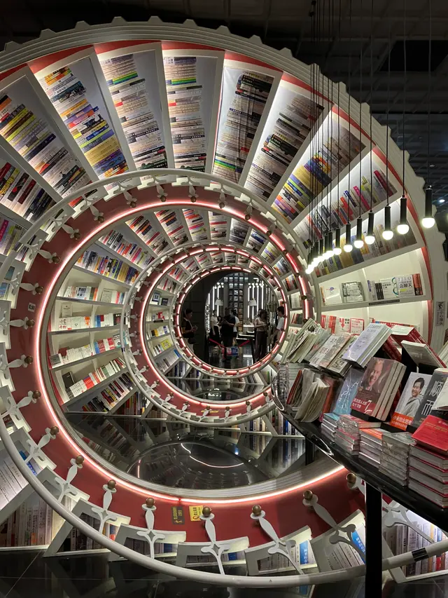 Circular illuminated bookshelves inside the famous Zhongshuge bookstore