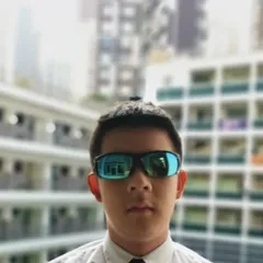 Headshot of James inside his high school campus